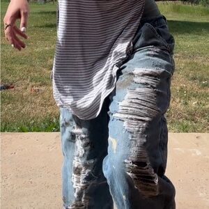 Distressed paint splattered Blue Levi’s
